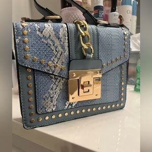 Snake print leather and gold fixtures hand band with crossbody strap